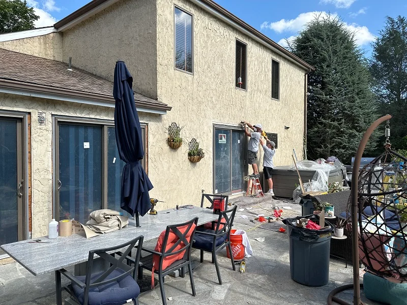 Cutting stucco to remove the patio doors